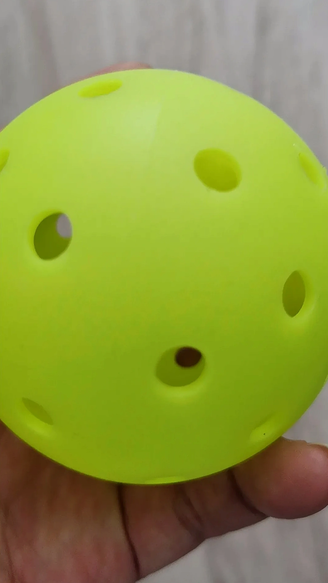 Players Engaging in Night Pickleball under Stadium Lighting