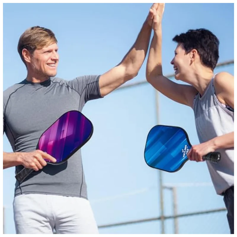 organized pickleball set laid out on court surface